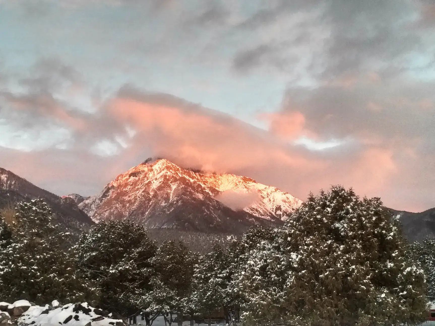 Sunset over the Sangre de Cristo mountain range, covered in snow