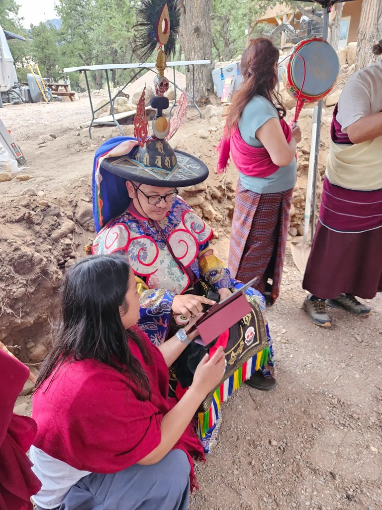 Adzom Gyalse Rinpoche blessing the ground with his Sangha during the Stupa construction
