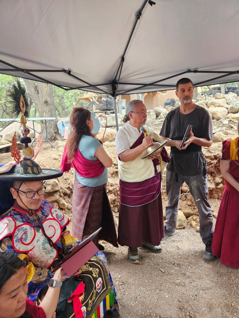 Adzom Gyalse Rinpoche blessing the ground with his Sangha during the Stupa construction