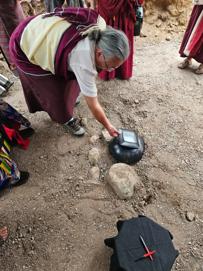 Adzom Gyalse Rinpoche blessing the ground with his Sangha during the Stupa construction