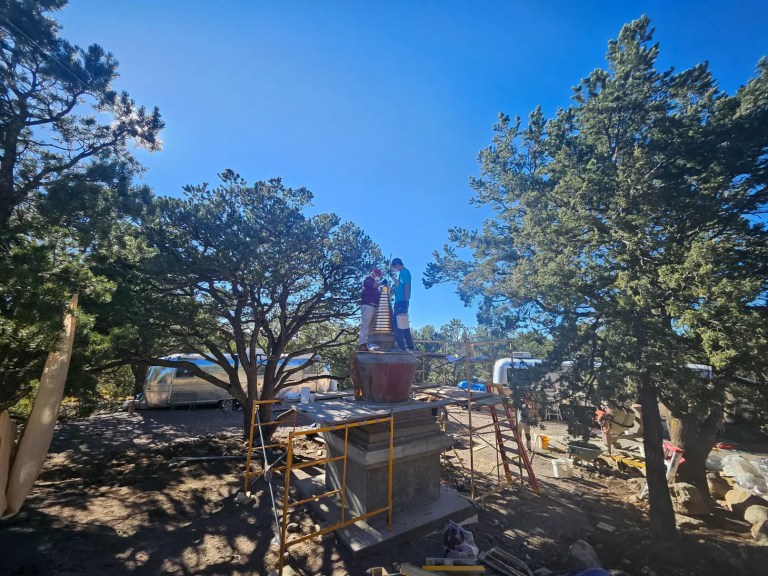 Stupa construction, placing the crown